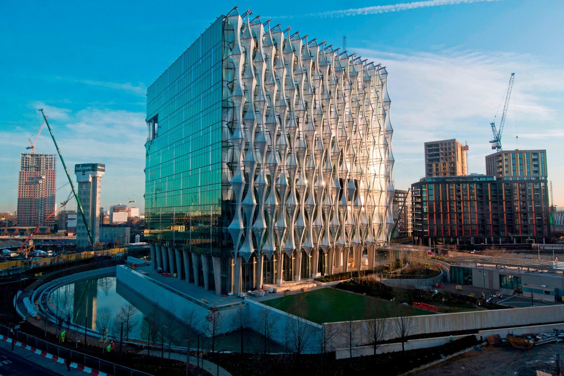 High-security diplomatic estate in London with sculpted glass façade, secure perimeter and water feature standoff