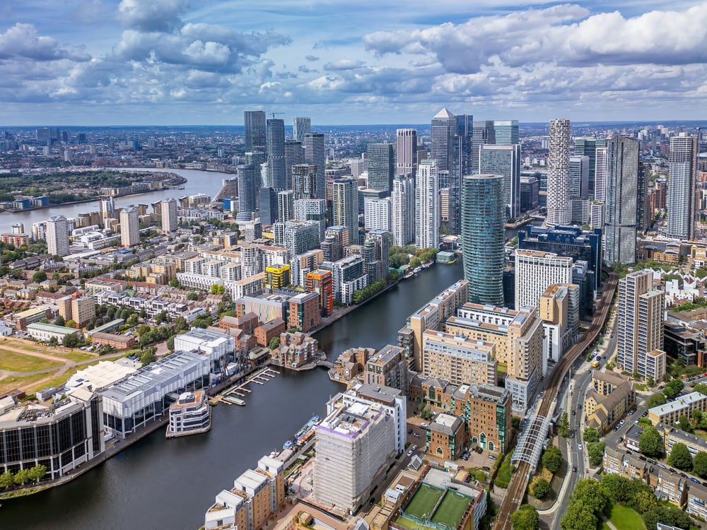 Aerial view of Canary Wharf and the London Docklands skyline — dense urban public realm environment